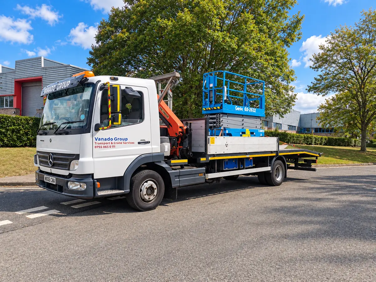 Vanado Group HIAB lorry carrying a scissor lift